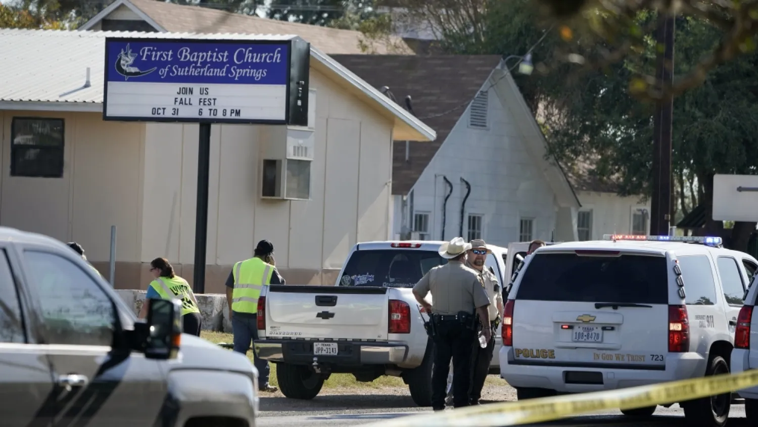 Law enforcement officers gather in front of the First Baptist Church of Sutherland Springs after the fatal shooting. Darren Abate/AP Photo