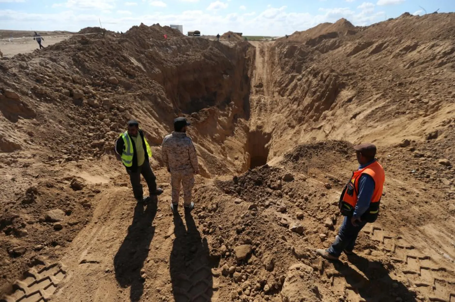 Rescue workers in Gaza searched for missing Palestinians after Israel blew up a cross-border tunnel in Khan Younes. (Reuters)