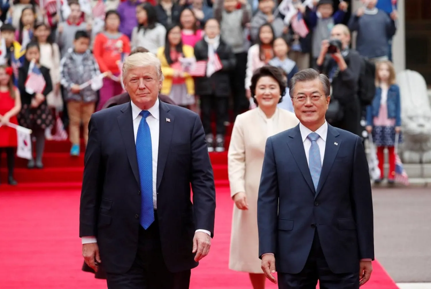 US President Donald Trump walks with South Korea's President Moon Jae-in during a welcoming ceremony at the Presidential Blue House in Seoul, South Korea. (Reuters)