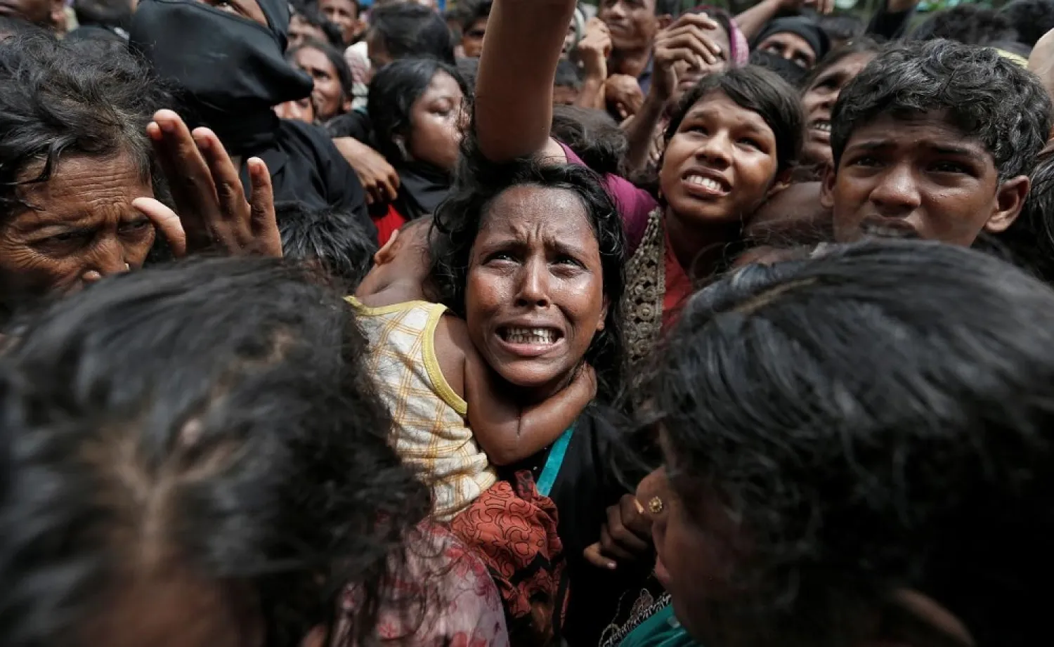 A woman reacts as Rohingya refugees wait to receive aid in Cox's Bazar, Bangladesh, September 21, 2017. (Reuters)