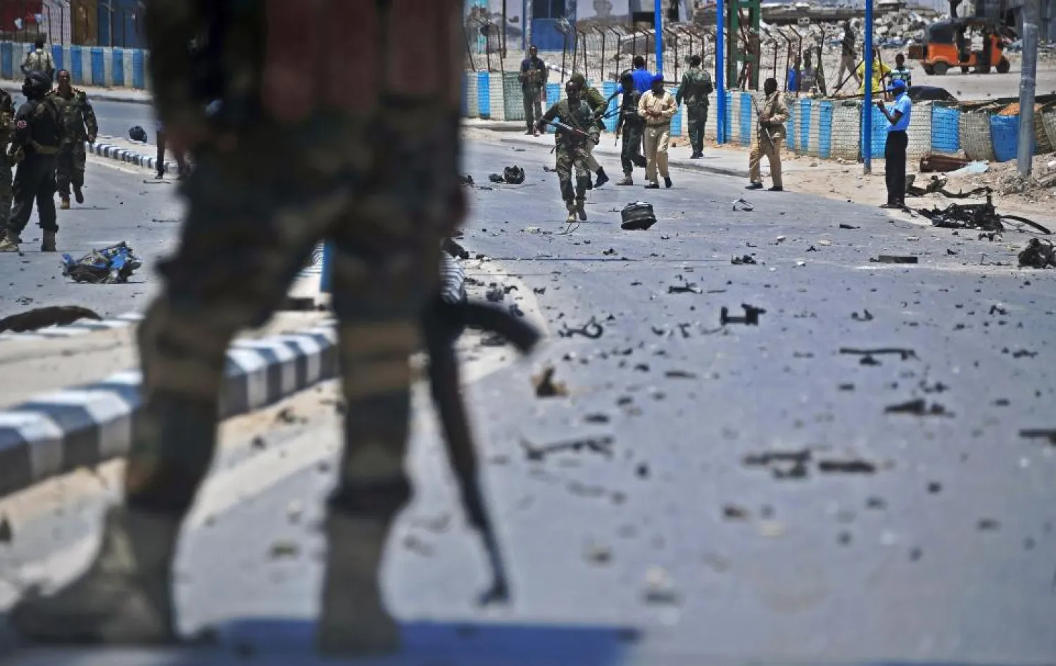 File photo: Somali security forces patrol the scene of a suicide car bomb in Mogadishu. MOHAMED ABDIWAHAB/AFP 