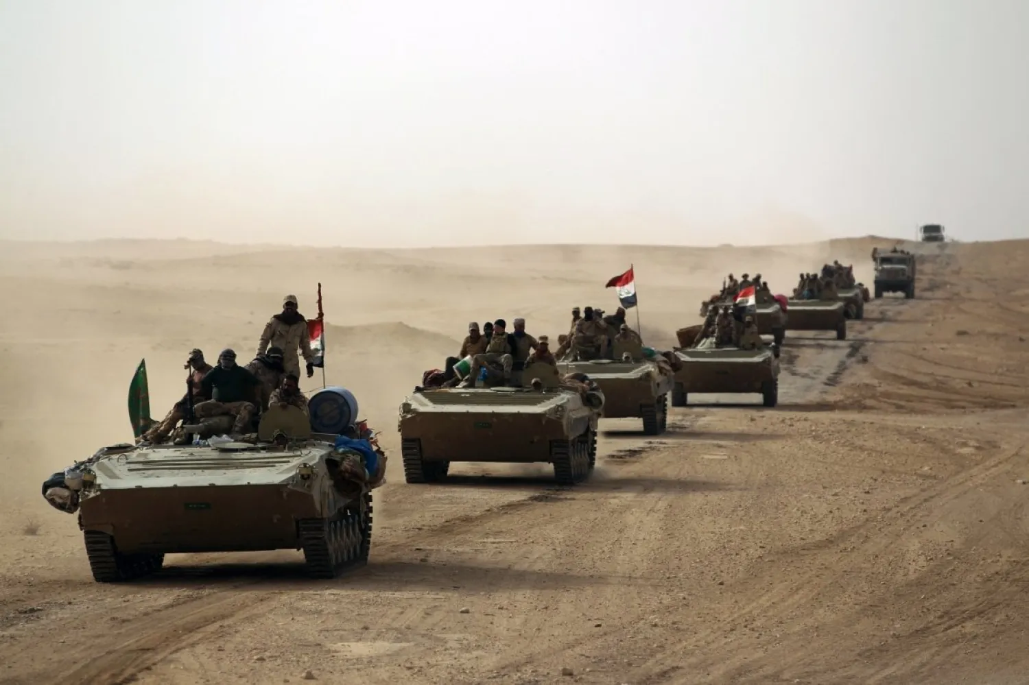 Iraqi forces and members of the PMF advance towards the city of al-Qaim. Ahmad al-Rubaye/AFP 