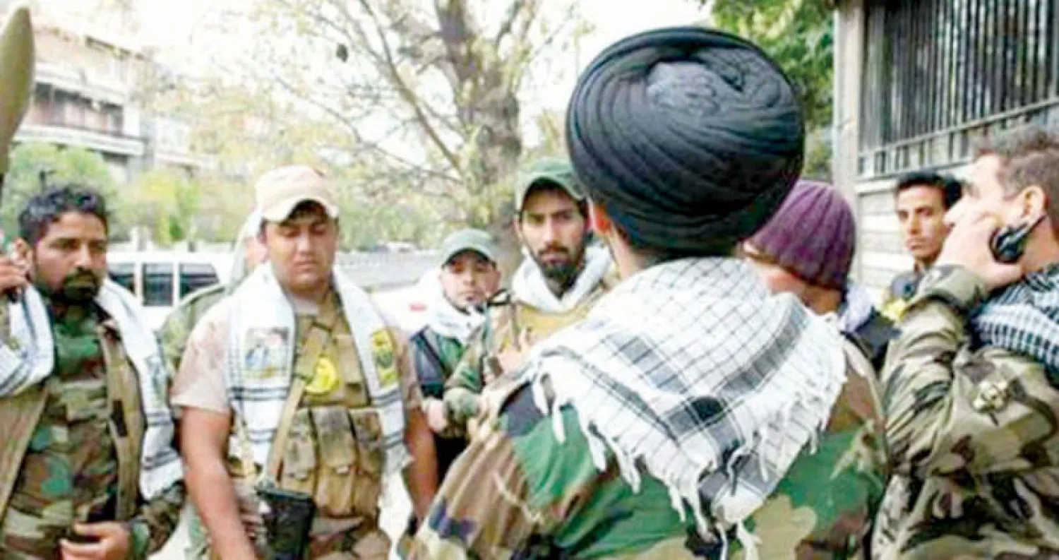 مقاتلون من ميليشيا النجباء العراقية الموالية لإيران قرب دمشق (حركة النجباء)