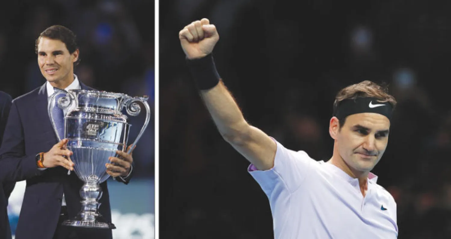 فيدرر يحتفل بانتصاره على سوك (أ.ب)  -  نادال وجائزة صدارة التصنيف (أ.ف.ب)