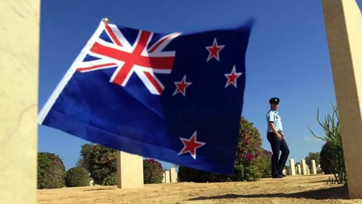 A soldier walks amongst graves of World War Two soldiers and past a New Zealand flag after a ceremony to mark the 70th anniversary of the Battle of El-Alamein in El-Alamein October 20, 2012. REUTERS/Mohamed Abd El Ghany
