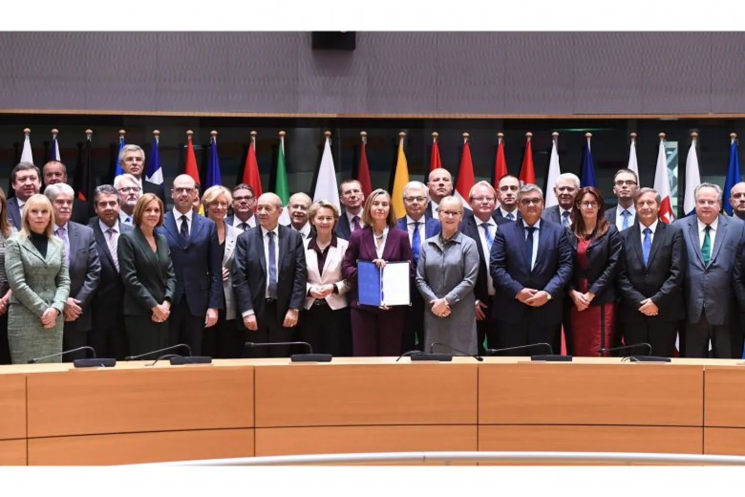 EU diplomatic chief Federica Mogherini (centre) with some foreign and defence ministers from 23 member states after the Pesco signing yesterday in Brussels.PHOTO: AGENCE FRANCE-PRESSE