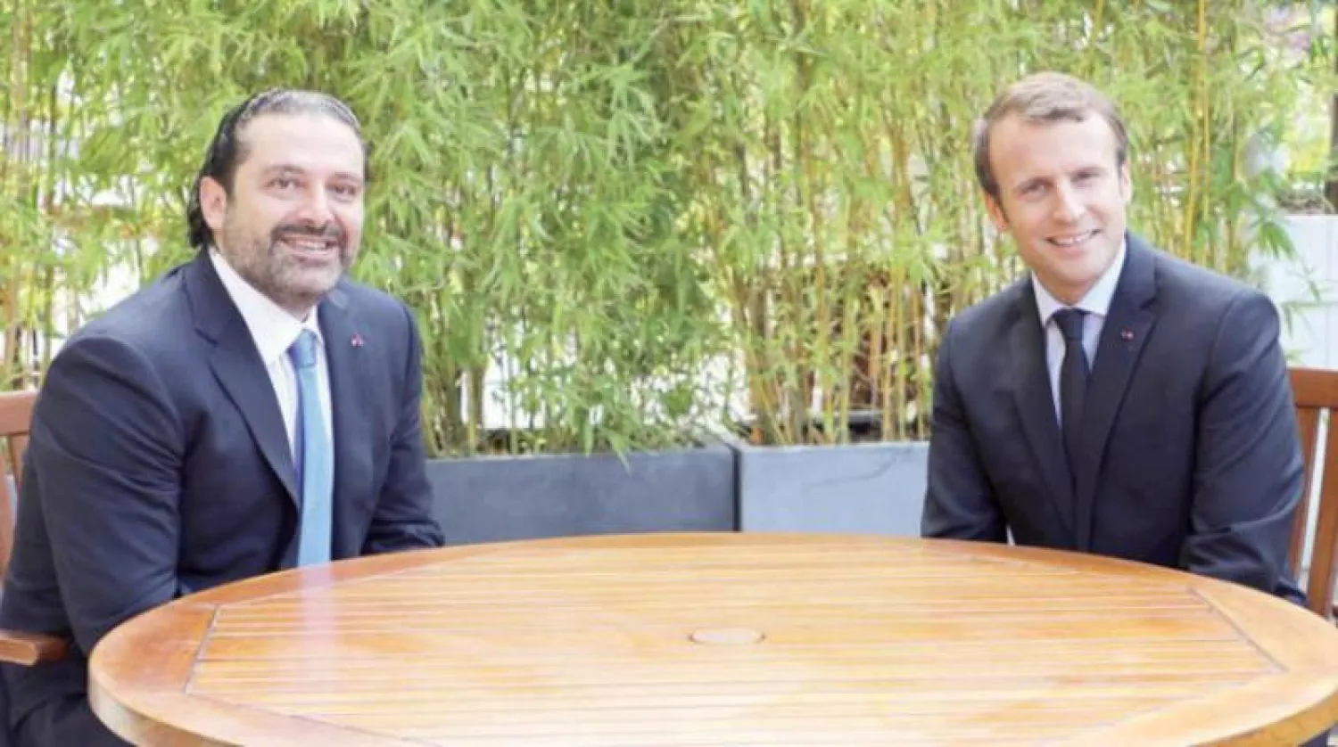 ماكرون والحريري خلال لقاء جمعهما في باريس مطلع سبتمبر (آ.ب)