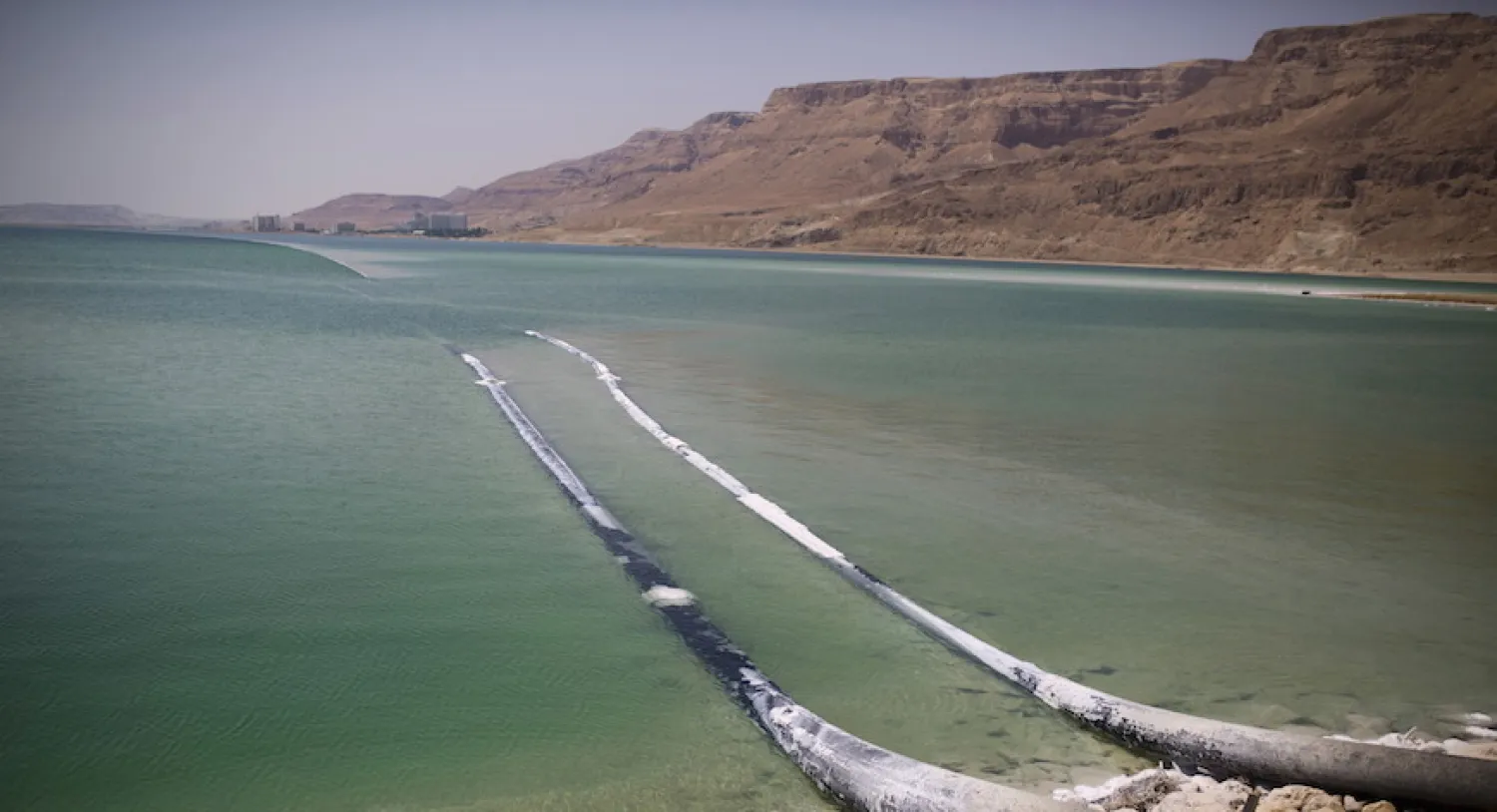 Pipes that pump water cross through evaporation pools, which make up the southern part of the Dead Sea, Israel, July 27, 2015 (REUTERS/Amir Cohen)
