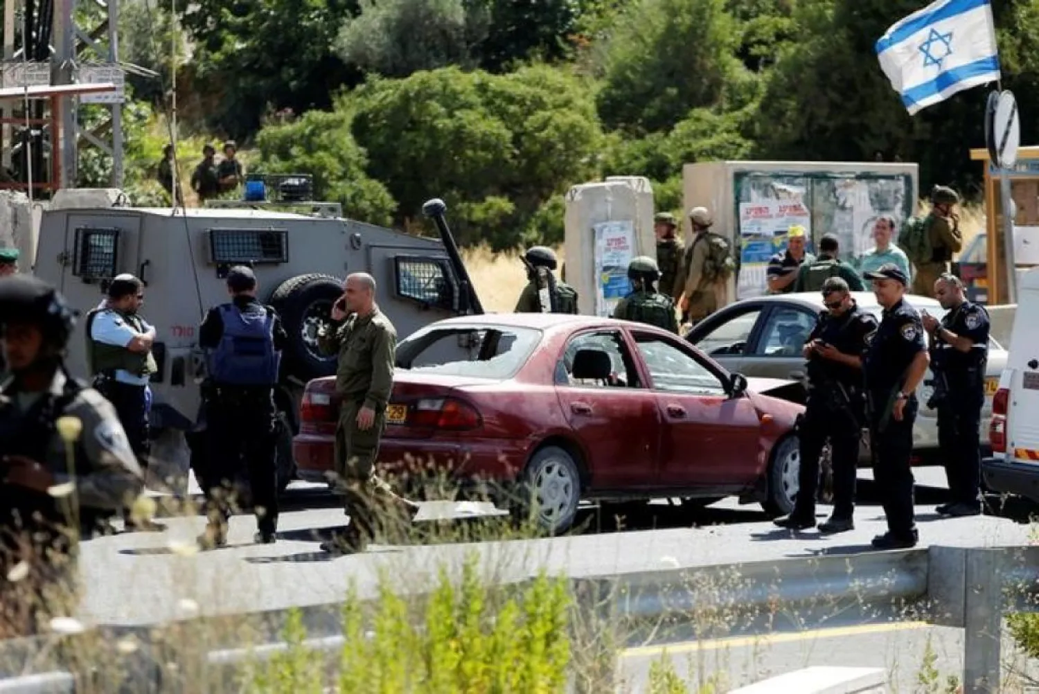 Israeli security forces gather at the scene where a female Palestinian was shot dead by Israeli troops at the entrance to Kiryat Arba near Hebron. Reuters file photo