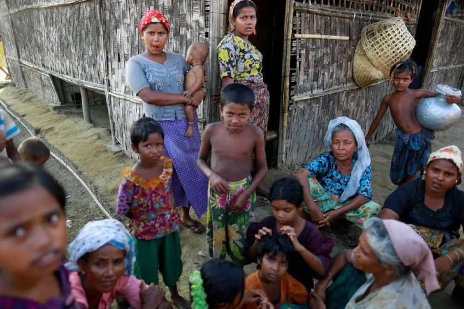 Rohingya Muslims pass time near their shelter at a refugee camp outside Sittwe June 4, 2014. REUTERS/Soe Zeya Tun