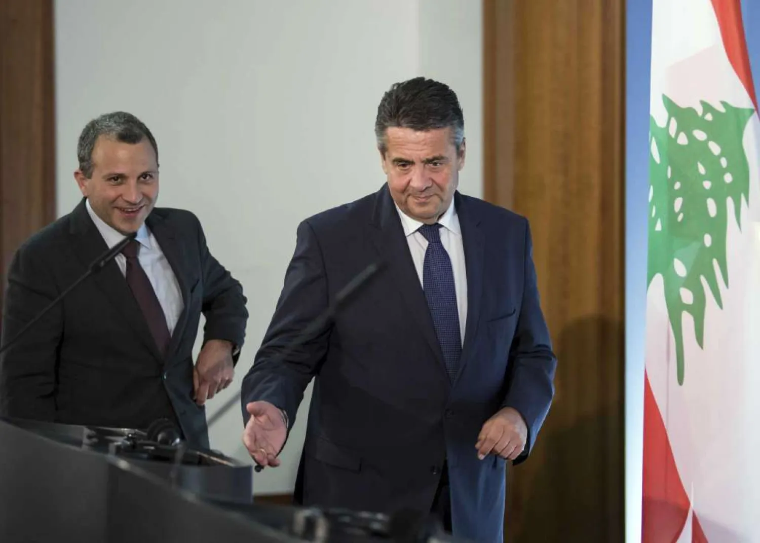 German Foreign Minister Sigmar Gabriel, right, and his counterpart from Lebanon, Jebran Bassil, arrive for a press conference in Berlin, Thursday, Nov. 16, 2017. (Soeren Stache/dpa via AP) 