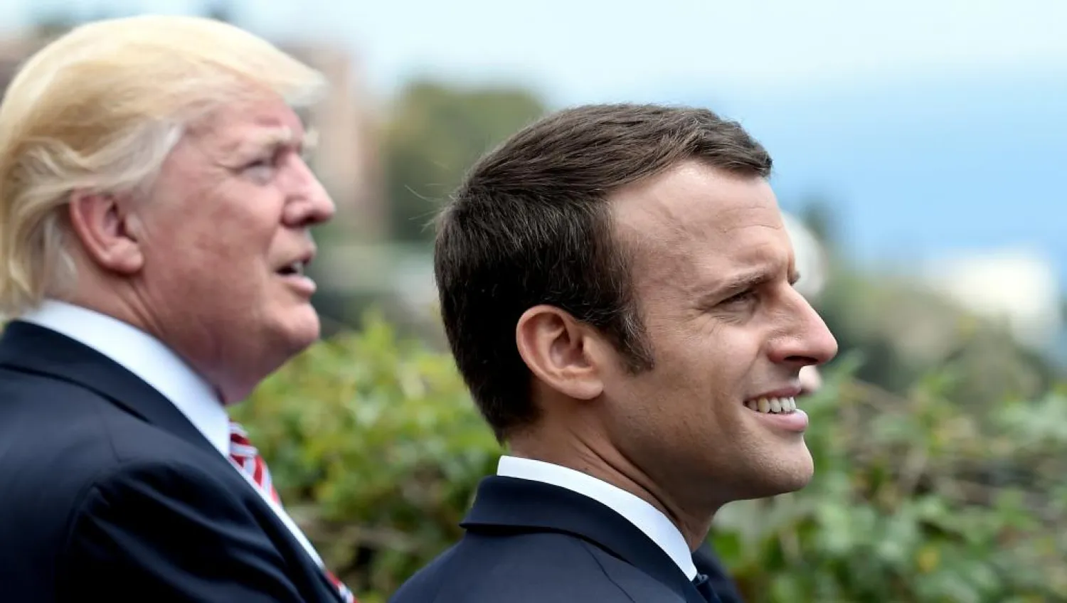 US President Donald Trump with Emmanuel Macron at a summit in Sicily in May. (Reuters)