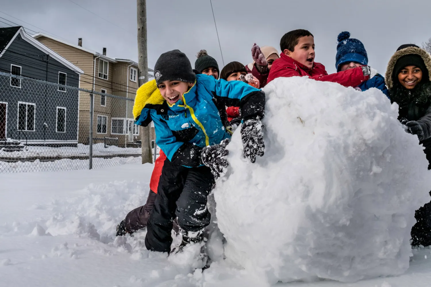 Eleven-year-old Basel Alrashdan (light blue jacket), who is from a Syrian refugee family resettled in Canada, plays with his friends from his school, Charlottetown on Prince Edward Island. UNICEF/Gilbertson VII Photo