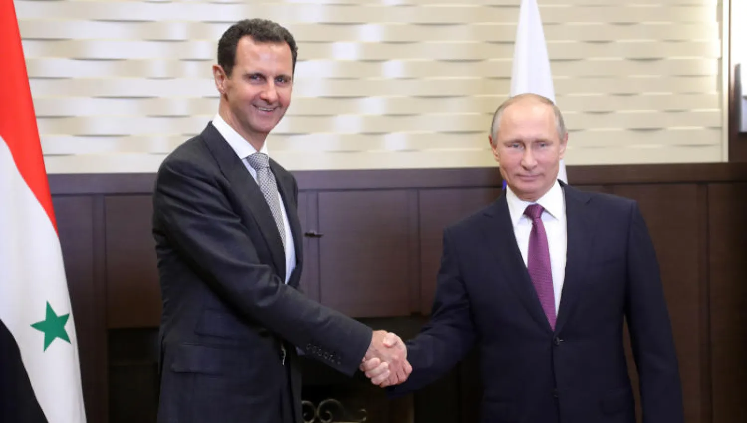 الرئيس الروسي فلاديمير بوتين خلال لقائه رئيس النظام السوري بشار الأسد (أ.ف.ب)