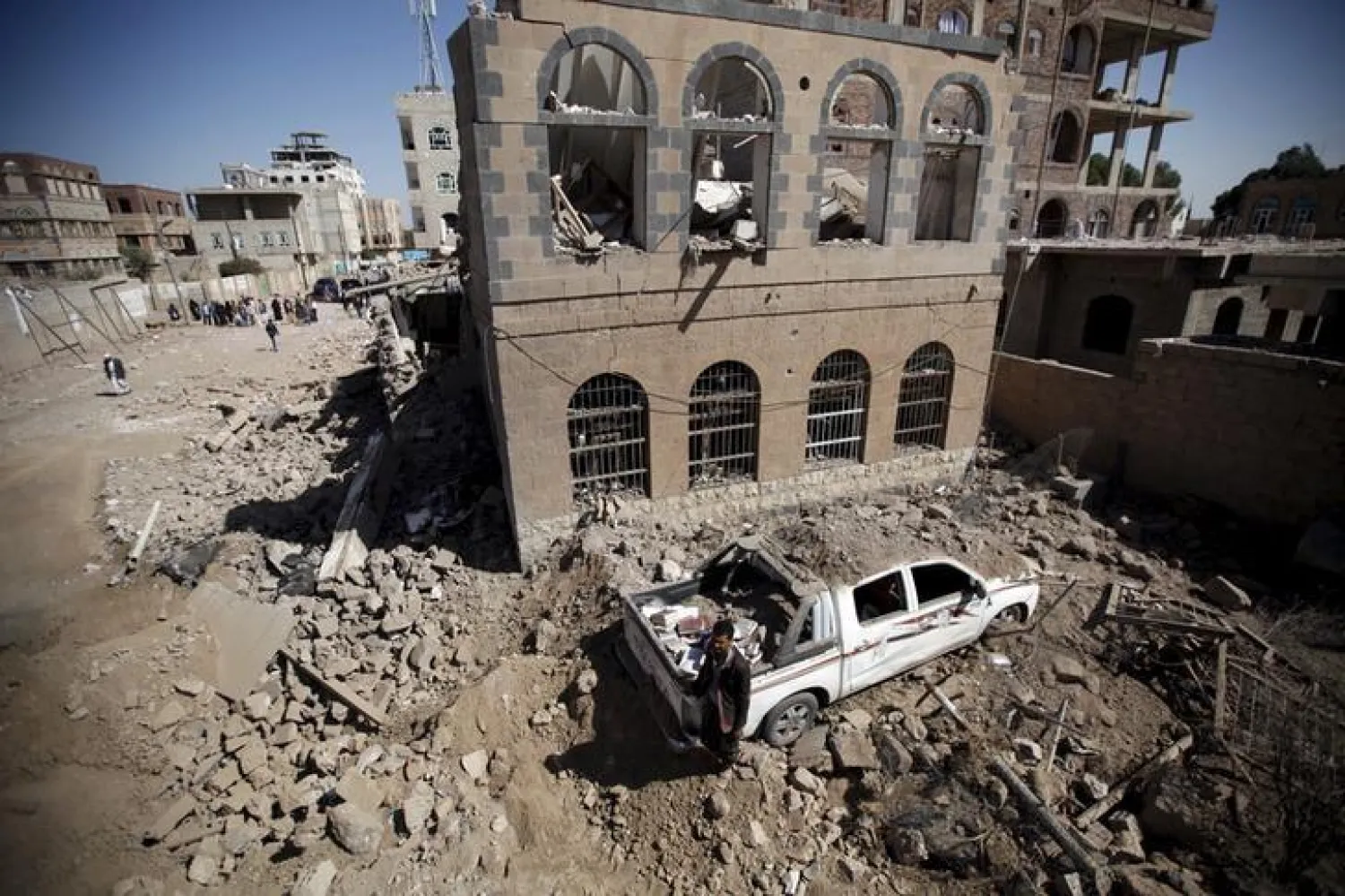 A man stands amid the rubble in Yemen's capital Sana’s. (Reuters)