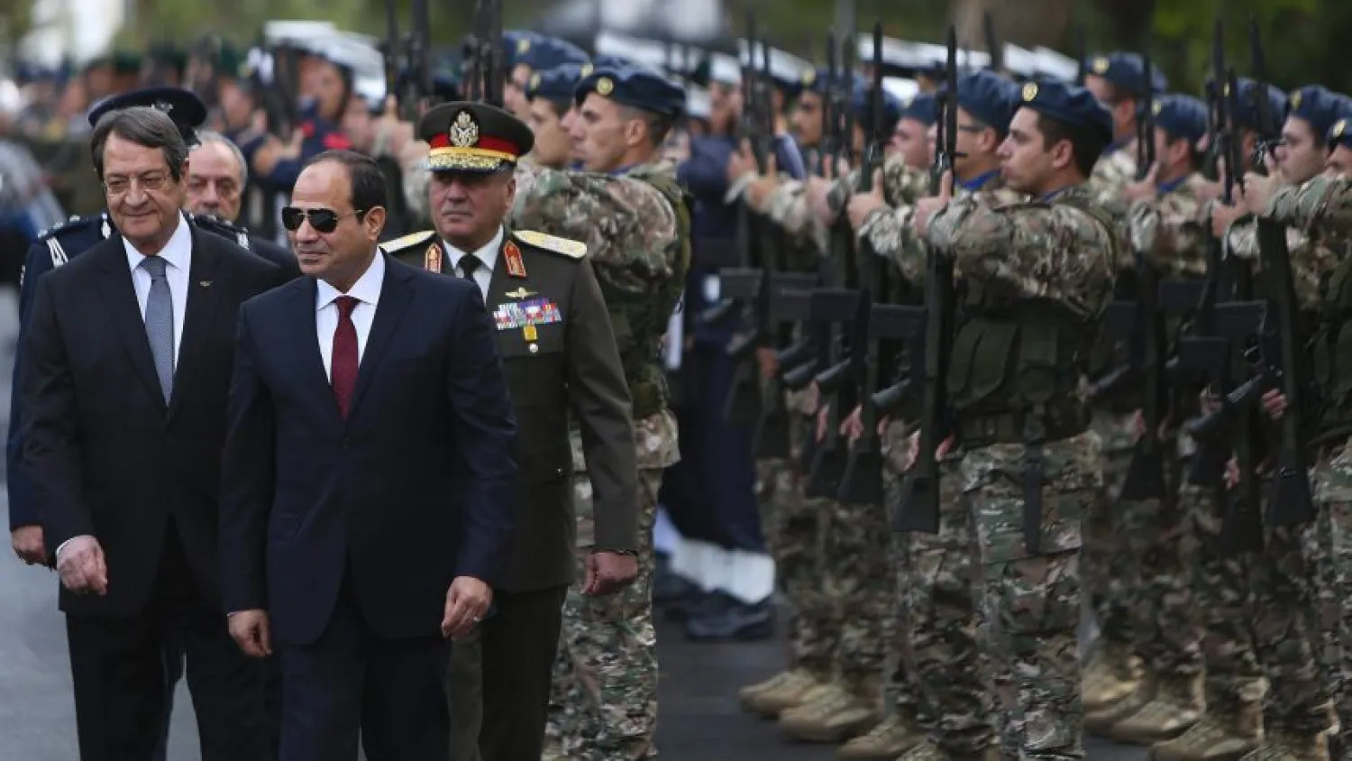 Egyptian President Abdul Fattah al-Sisi and Cypriot President Nicos Anastasiades review a military guard of honor following the Egyptian president's arrival in Cyprus. (AP) 