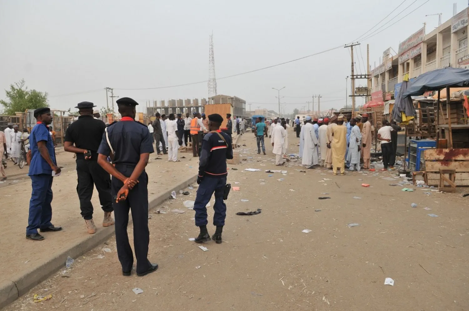 Security officers stand guard at the scene of an explosion in Nigeria. (AP)