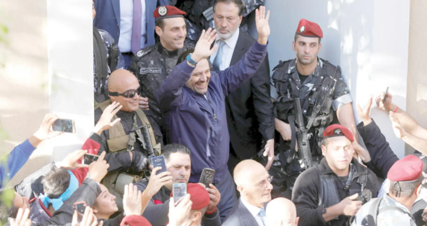 الحريري يتحدث أمس أمام بيت الوسط (رويترز)