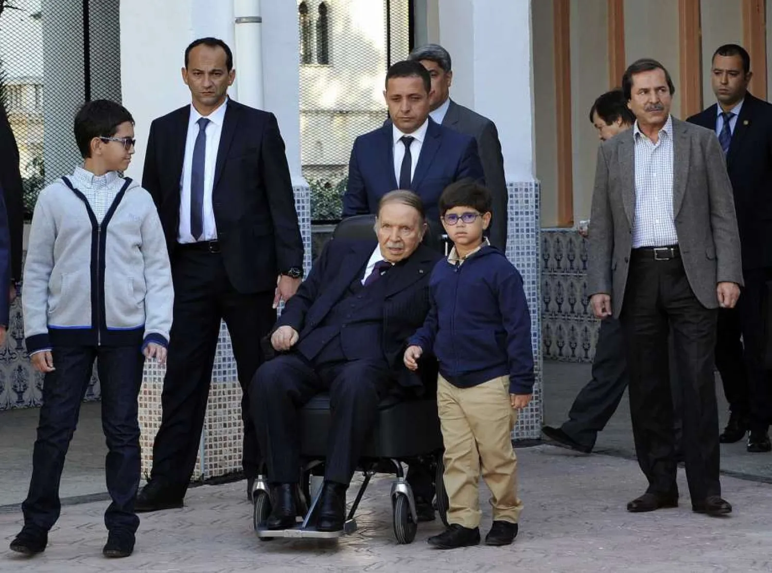 Algerian President Abdelaziz Bouteflika leaves with his unidentified nephew and his brother Said Bouteflika, right, after voting for local elections in Algiers Thursday, Nov.23, 2017. (AP) 

