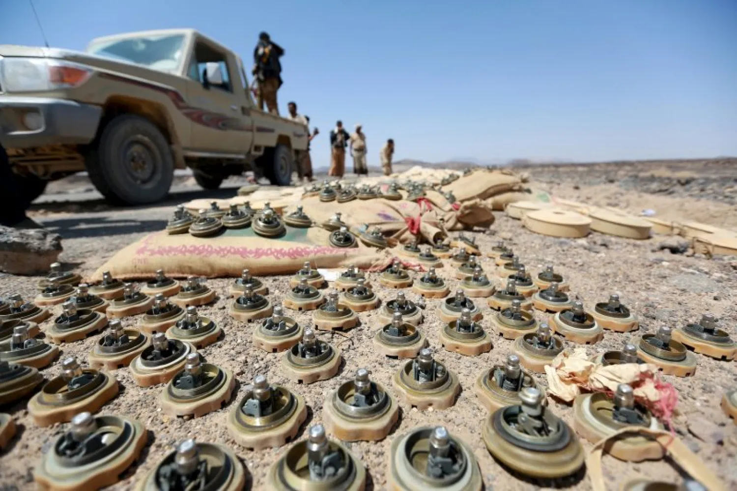 Soldiers loyal to Yemen's government stand next to mines planted by Houthis. Reuters file photo