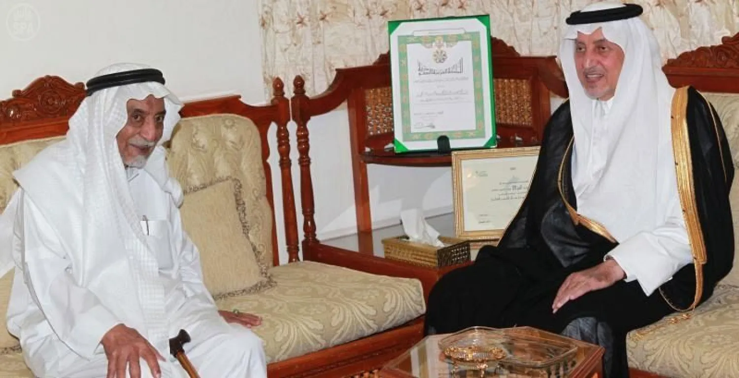 Governor of the Mecca province Prince Khalid al-Faisal bin Abdulziz pays a visit to poet Ibrahim al-Khafaji in 2012. (SPA)