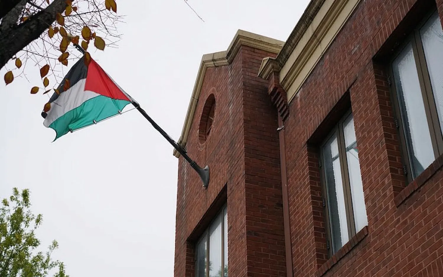 The Palestinian flag is seen above the offices of the Palestine Liberation Organization in Washington, DC, November 18, 2017. MANDEL NGAN/AFP