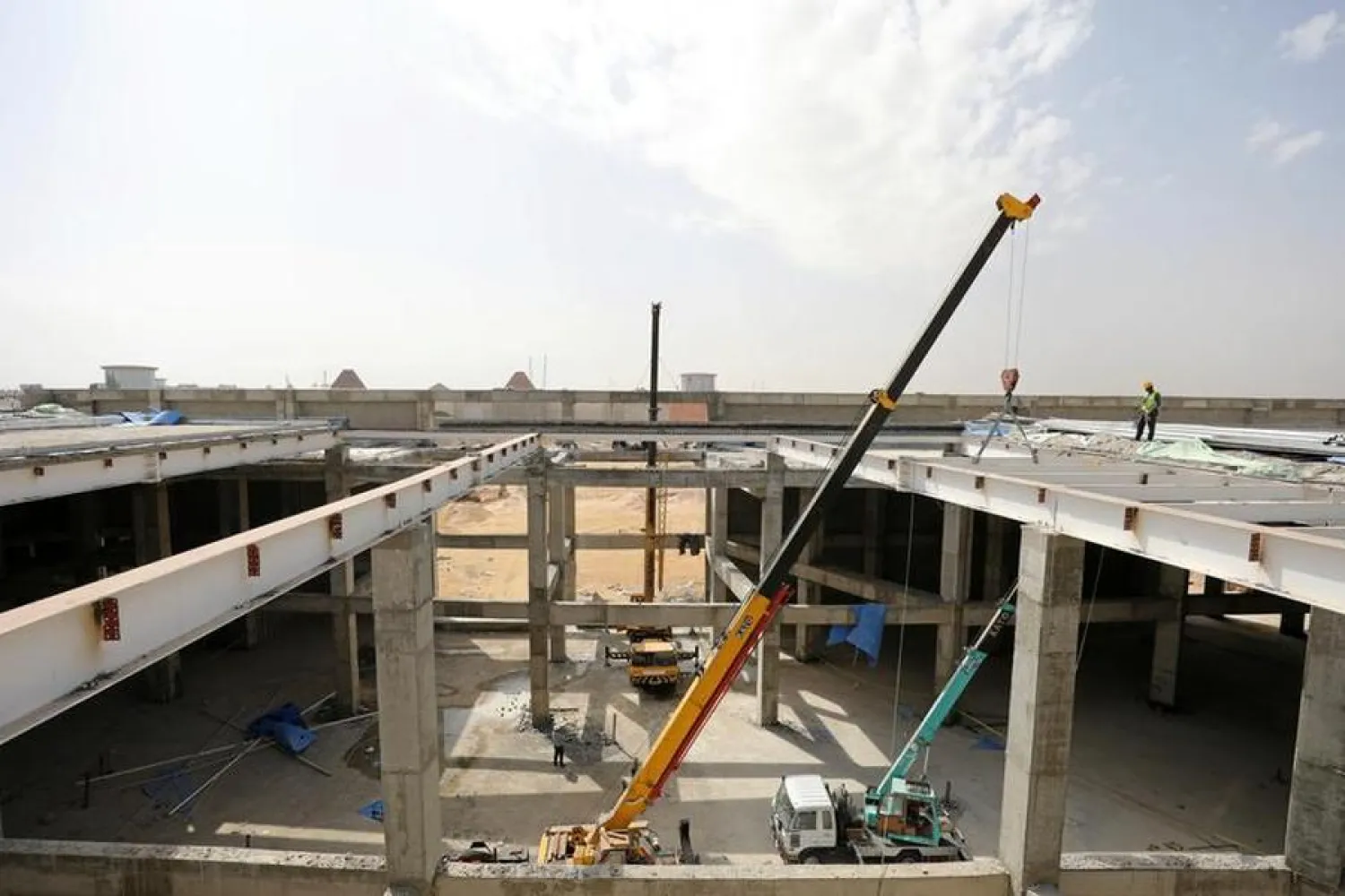 Workers are seen at a construction site as they work to build an extension to Mall of Arabia in Cairo, Egypt, March 22, 2017. REUTERS/Mohamed Abd El Ghany REUTERS/Mohamed Abd El Ghany