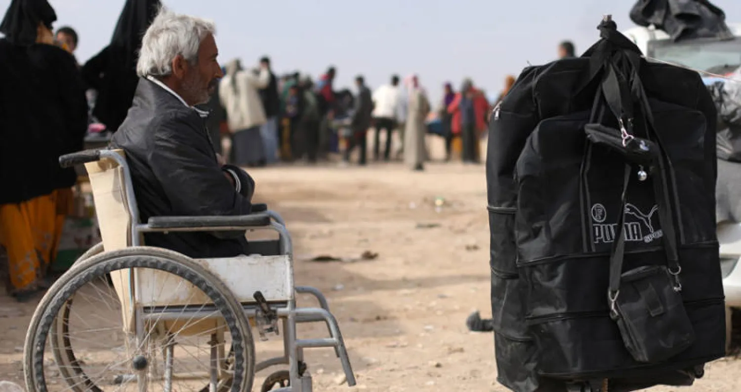 نازح مقعد من دير الزور في مخيم قانا قرب الحسكة شمال شرق سوريا (رويترز)