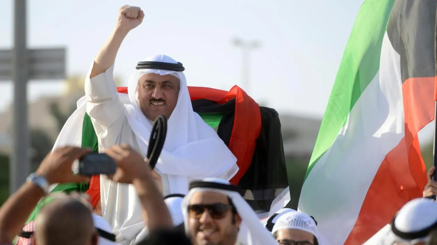 Supporters celebrate with opposition leader Musallam Al Barrack in Kuwait City on April 20, 2015 after his release on bail ahead of a final decision on charges he insulted the country's ruler. (AP)