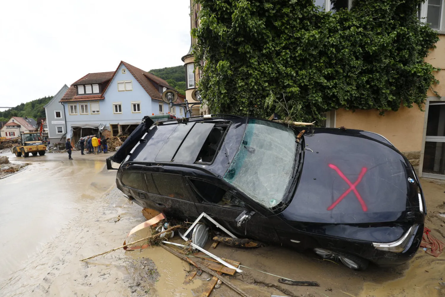 A damaged car is pictured Monday after floods in the town of
Braunsbach, Germany./ KAI PFAFFENBACH/REUTERS