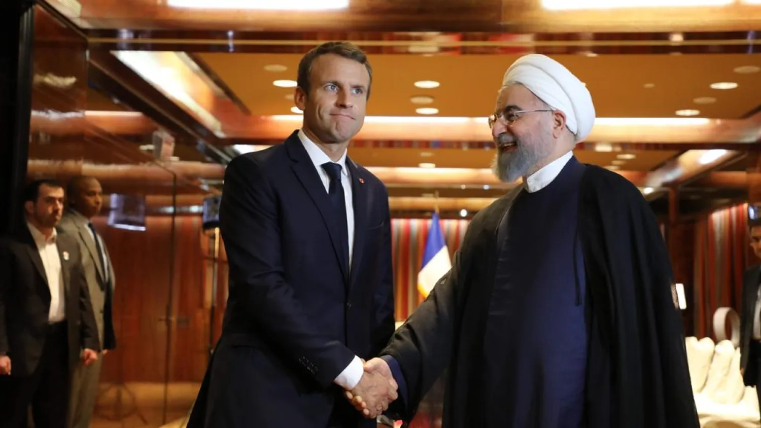 French president Emmanuel Macron, left, greets Iranian president Hassan Rouhani at the Millenium Hotel in New York on September 18, 2017. Ludovic Marin / AFP