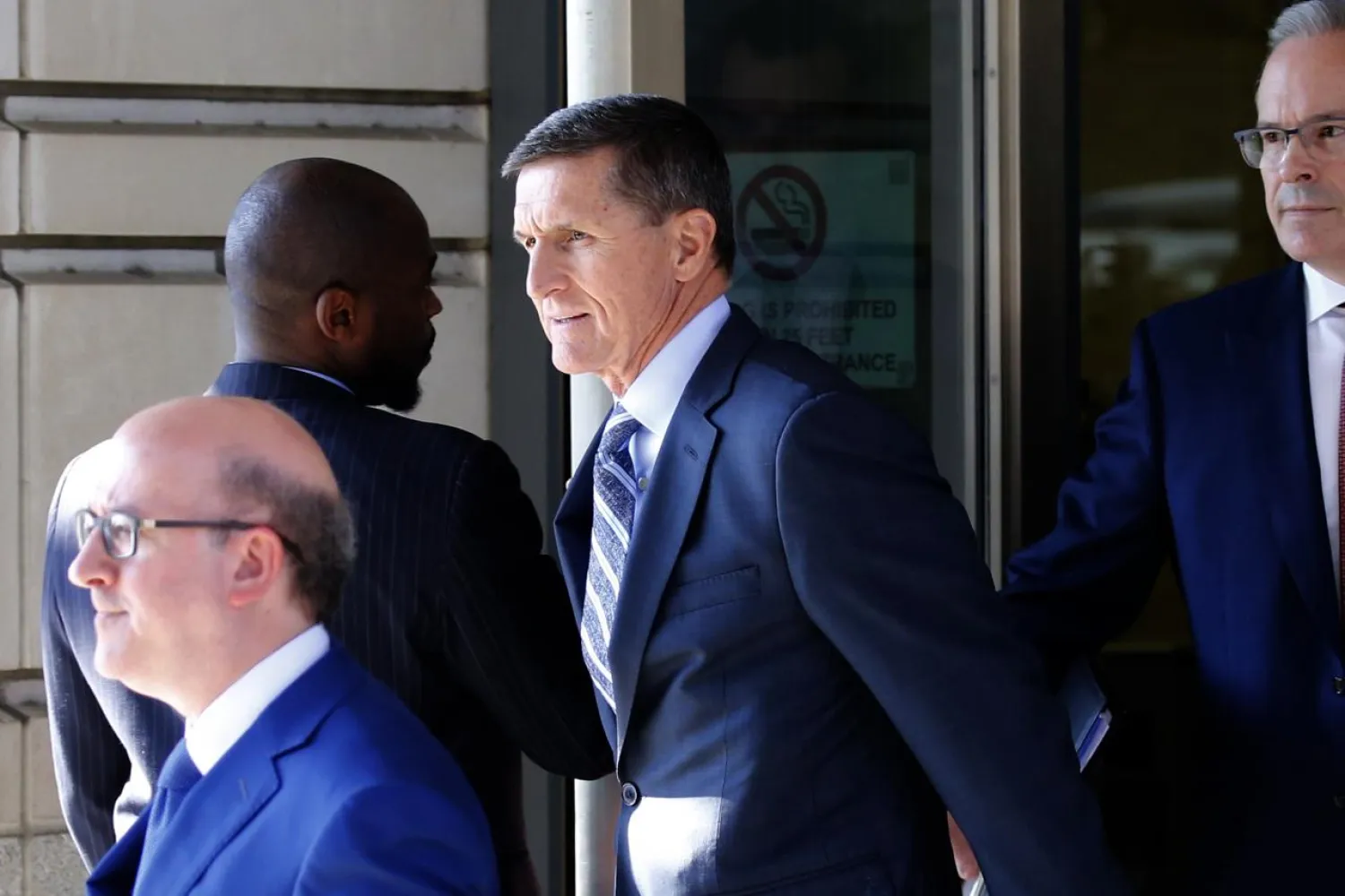 Former U.S. National Security Adviser Michael Flynn departs U.S. District Court, where he was expected to plead guilty to lying to the FBI about his contacts with Russia's ambassador to the United States, in Washington, U.S., December 1, 2017. REUTERS/Jonathan Ernst
