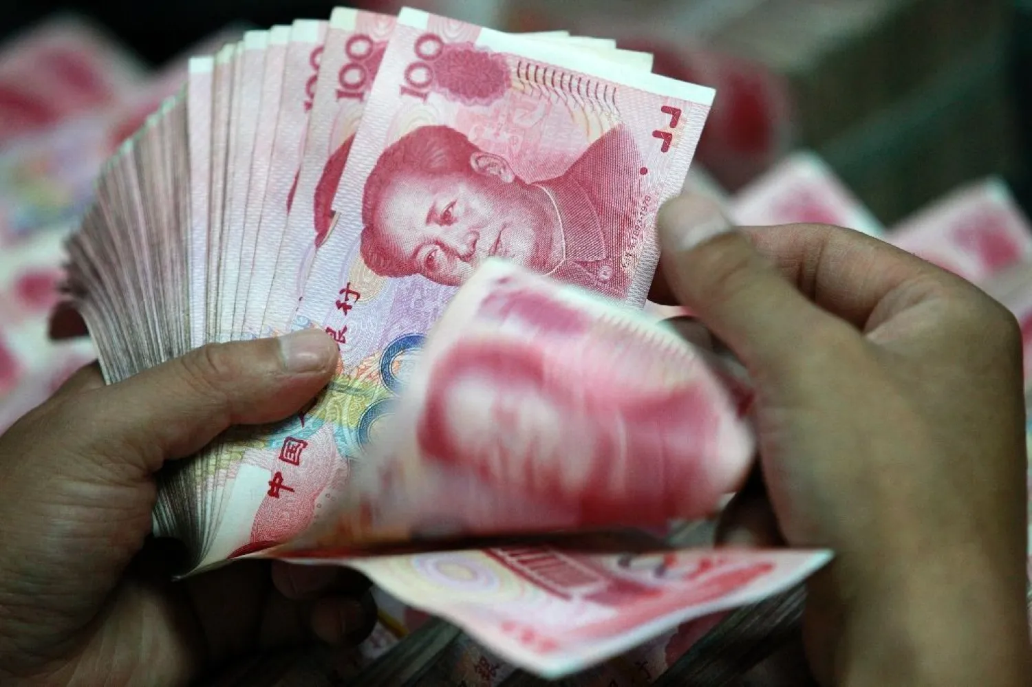 More than 10,000 people have used an underground bank to effectively funnel billions of dollars out of China. (AFP)
