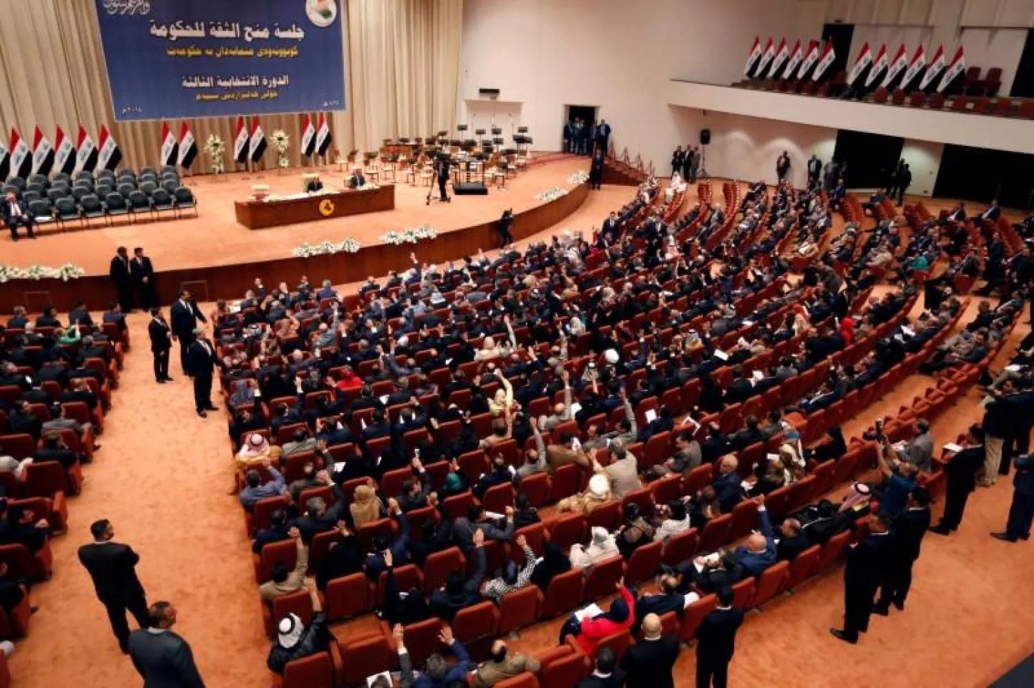 Members of the Iraqi parliament gather to vote on Iraq's new government at the parliament headquarters in Baghdad, September 8, 2014. REUTERS/Thaier Al-Sudani