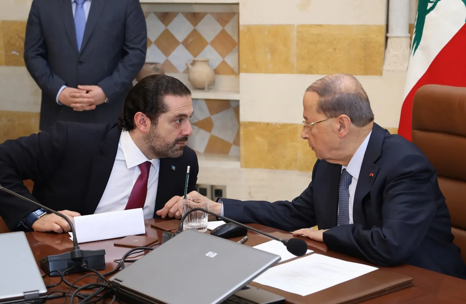 Lebanese President Michel Aoun talks with Prime Minister Saad Hariri during a government session on December 5, 2017. (Dalati & Nohra)