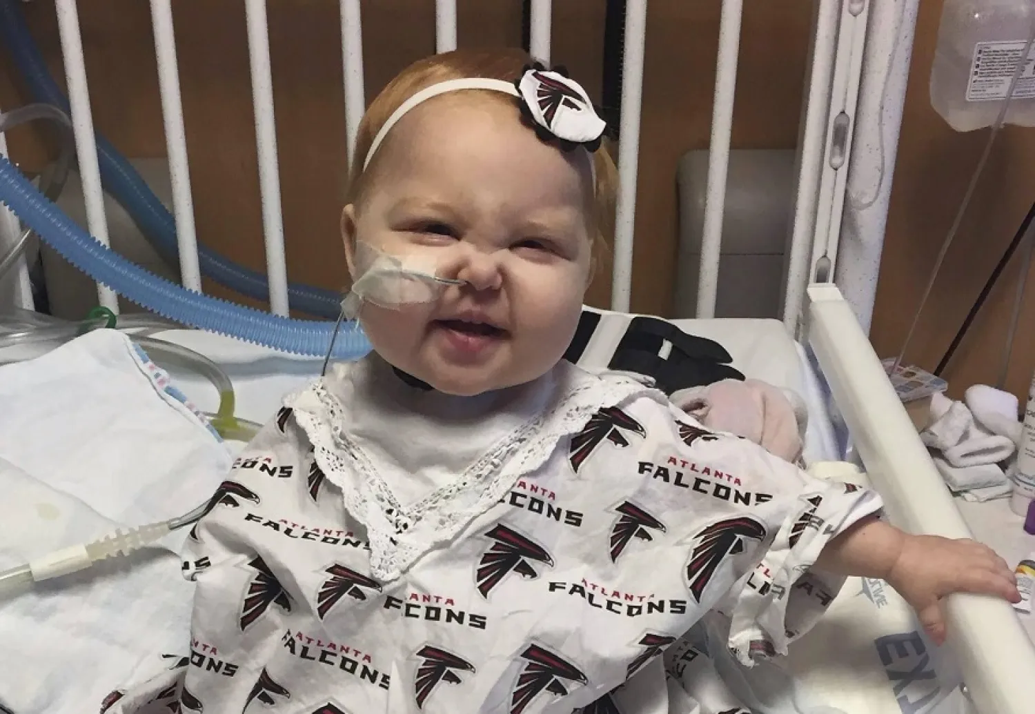 In this Jan. 22, 2017, photo provided by Children's Healthcare of Atlanta, 15-month-old Ella sits in a hospital bed at the Aflac Cancer Center of Children¿s Healthcare of Atlanta via AP