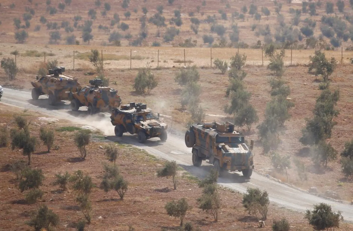 Turkish armored military vehicles patrol on the Turkish-Syrian borderline in Reyhanli, Hatay province, Turkey, October 8, 2017. REUTERS/Osman Orsal