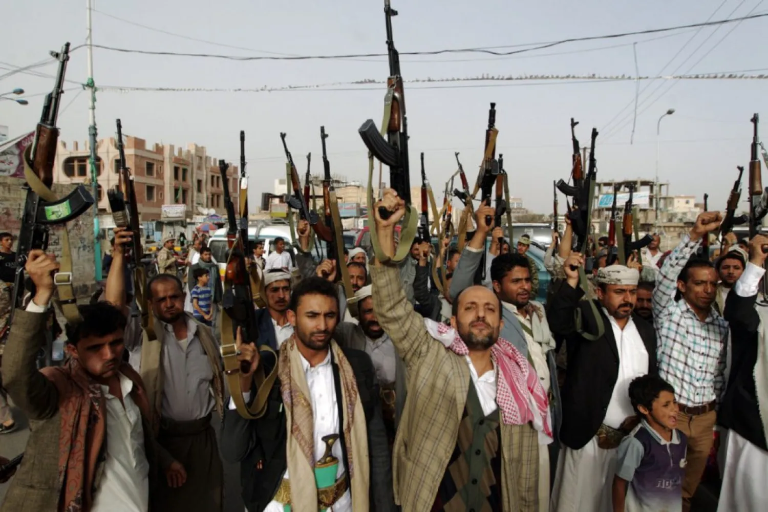 Houthi militants brandish their weapons during a rally in the Yemeni capital Sanaa. (AFP)