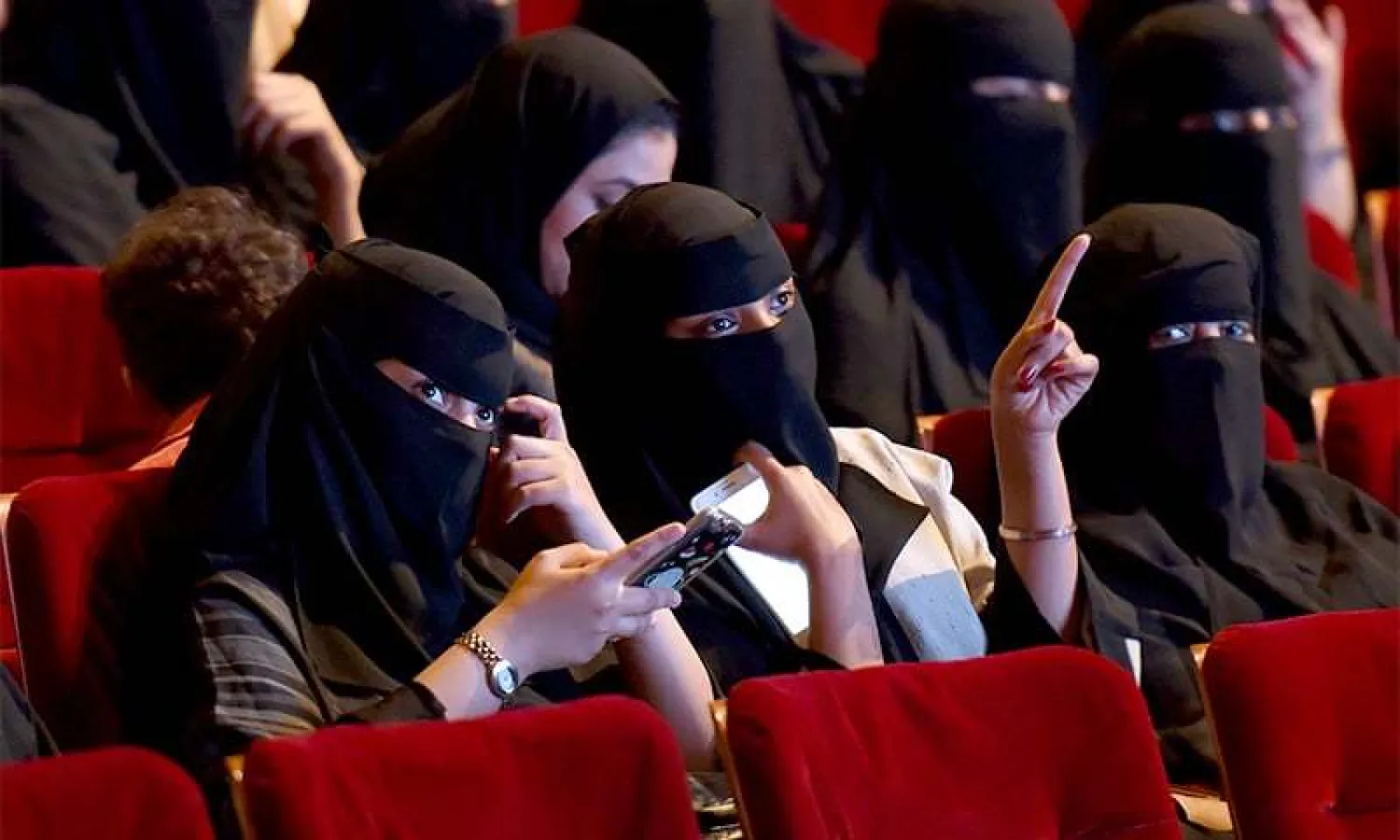 Saudi women attend a rare cinema screening at a film festival in Riyadh in October 2017.
(AFP)