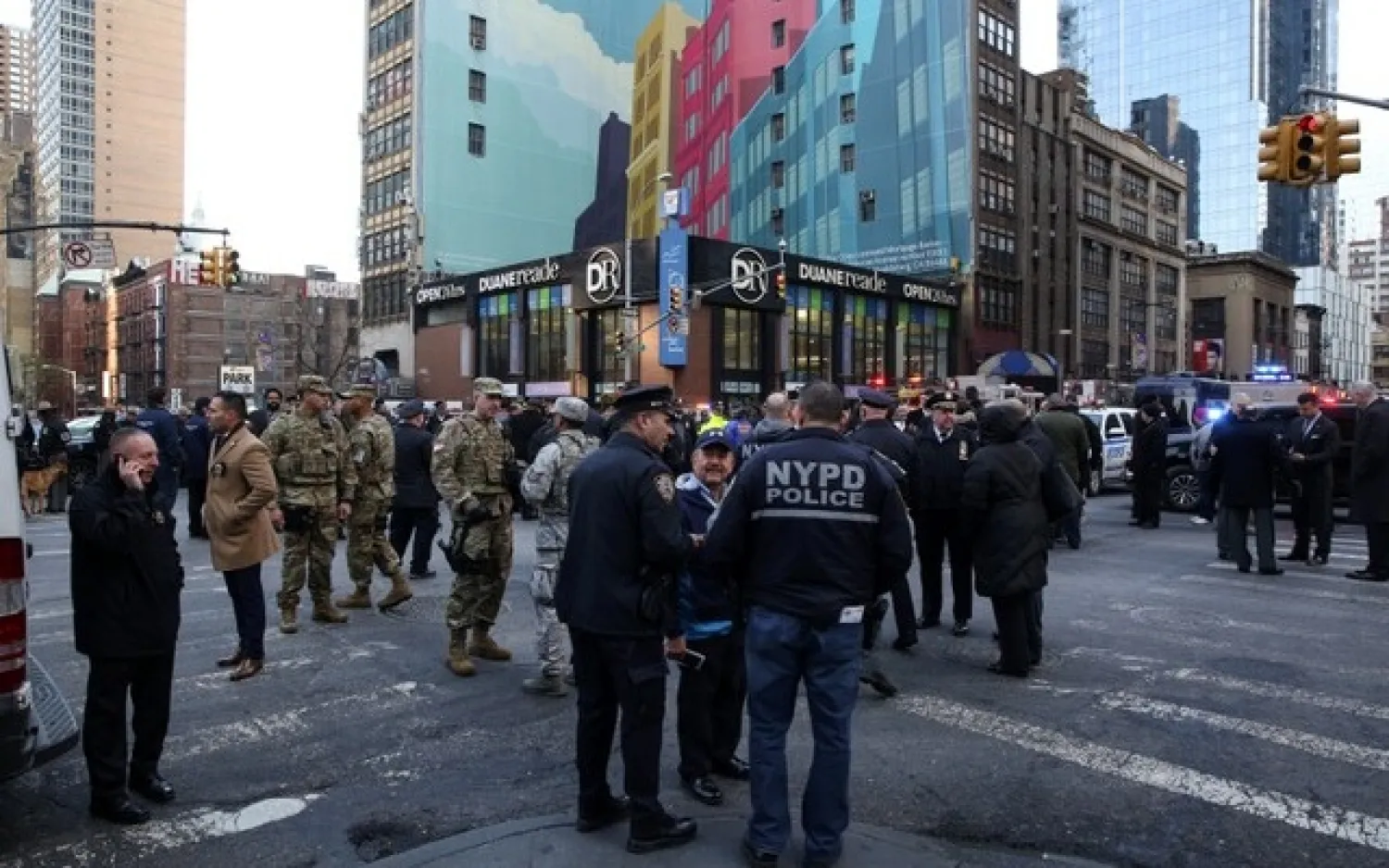 New York Police Department (NYPD) officers stand guard near Port Authority Bus Terminal after reports of explosion in Manhattan, New York, US, December 11, 2017. Reuters
