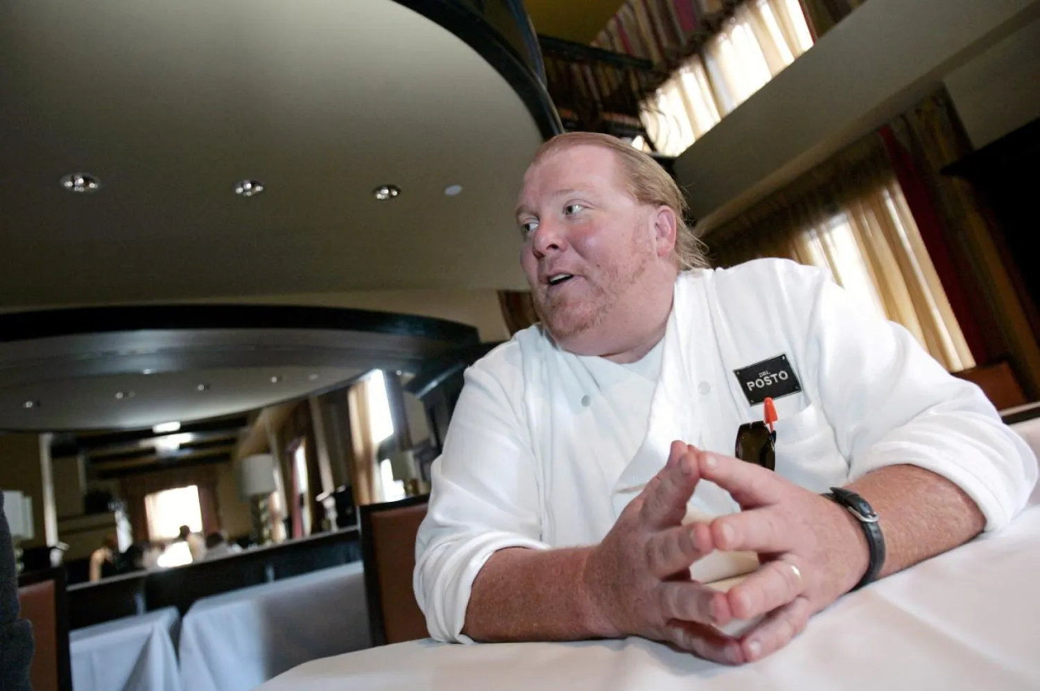  Celebrity chef Mario Batali talks during an interview with Reuters at his latest restaurant, Del Posto, in New York, U.S. on April 11, 2006. REUTERS/Brendan McDermid/File Photo