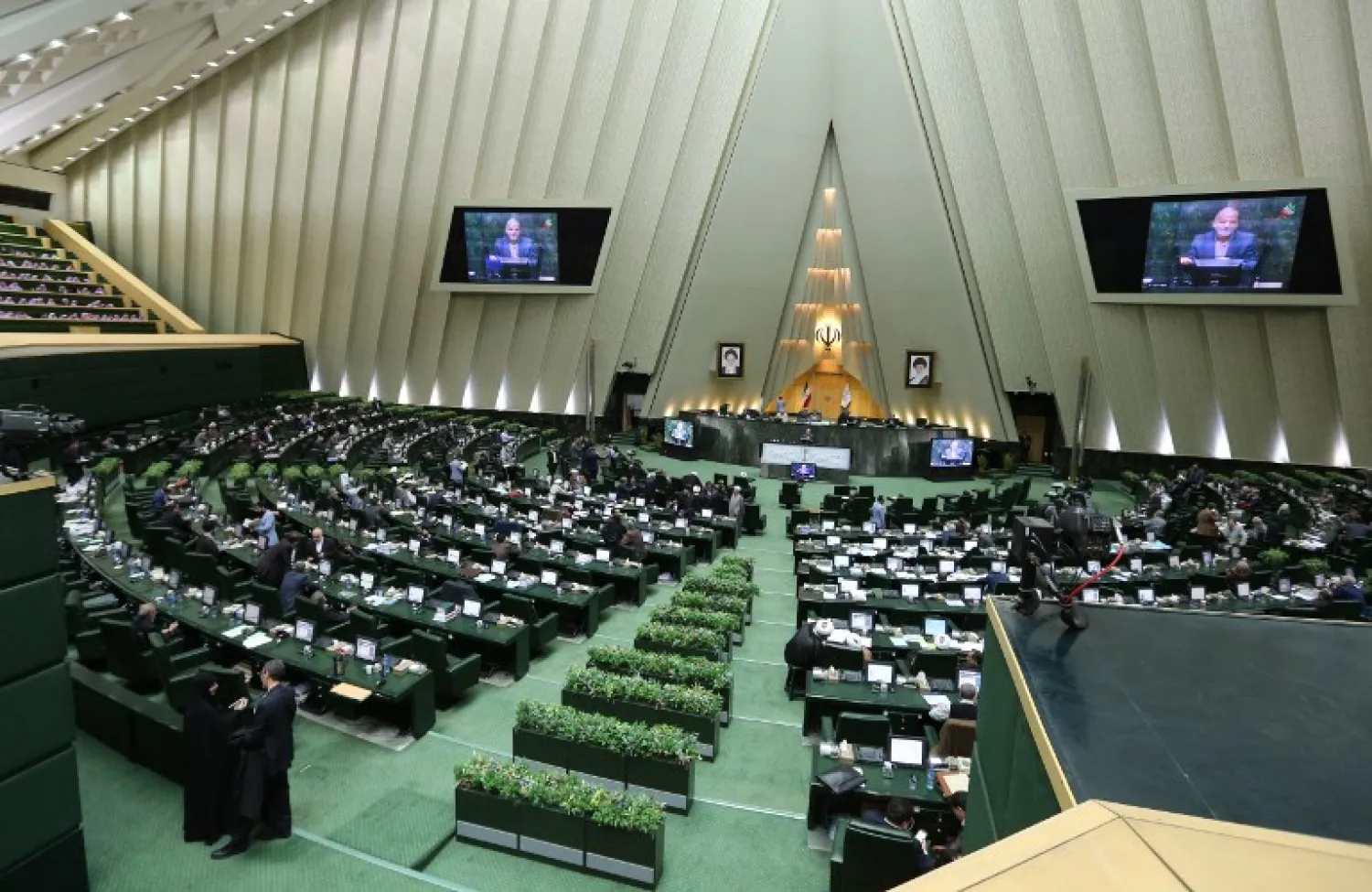 Iranian MPs attend a parliament session in Tehran. (AFP)