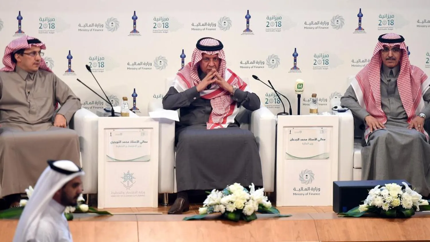  Saudi Finance Minister Mohammed al-Jadaan, right, Minister of Economy and Planning Mohammed al-Tuwaijri, centre, and Saudi Arabian Monetary Agency (SAMA) Governor Ahmed al-Khulaifi take part in a press conference during which officials announced the state budget for 2018. AFP/Fayez Nureldine