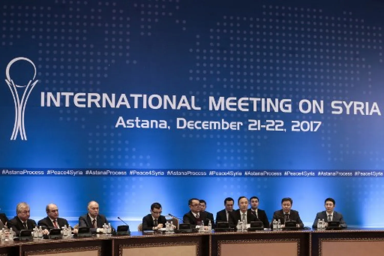 Kazakh Foreign Minister Kairat Abdrakhmanov (4th R) attends the session of Syria peace talks in Astana on December 22, 2017.  Stanislav FILIPPOV / AFP