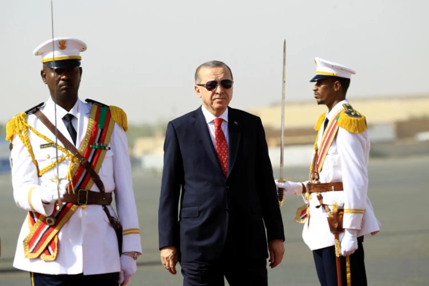 Turkey's President Recep Tayyip Erdogan inspect honor guard during arrival at Khartoum Airport, Sudan December 24, 2017. REUTERS/Mohamed Nureldin Abdallah

