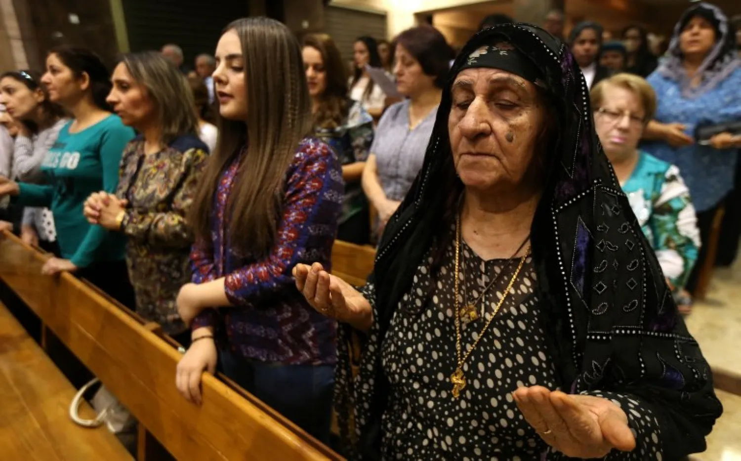Iraqi Christians attend a mass at the Church of Our Lady of Perpetual Help in Erbil, the capital of the autonomous Kurdish region of northern Iraq, on October 25, 2016. (AFP)