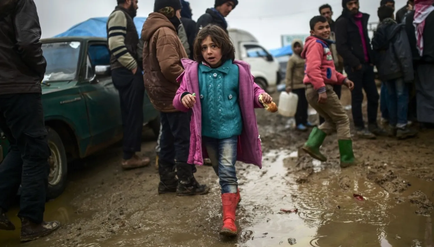 Syrian refugees near the Turkish border. (AFP)
