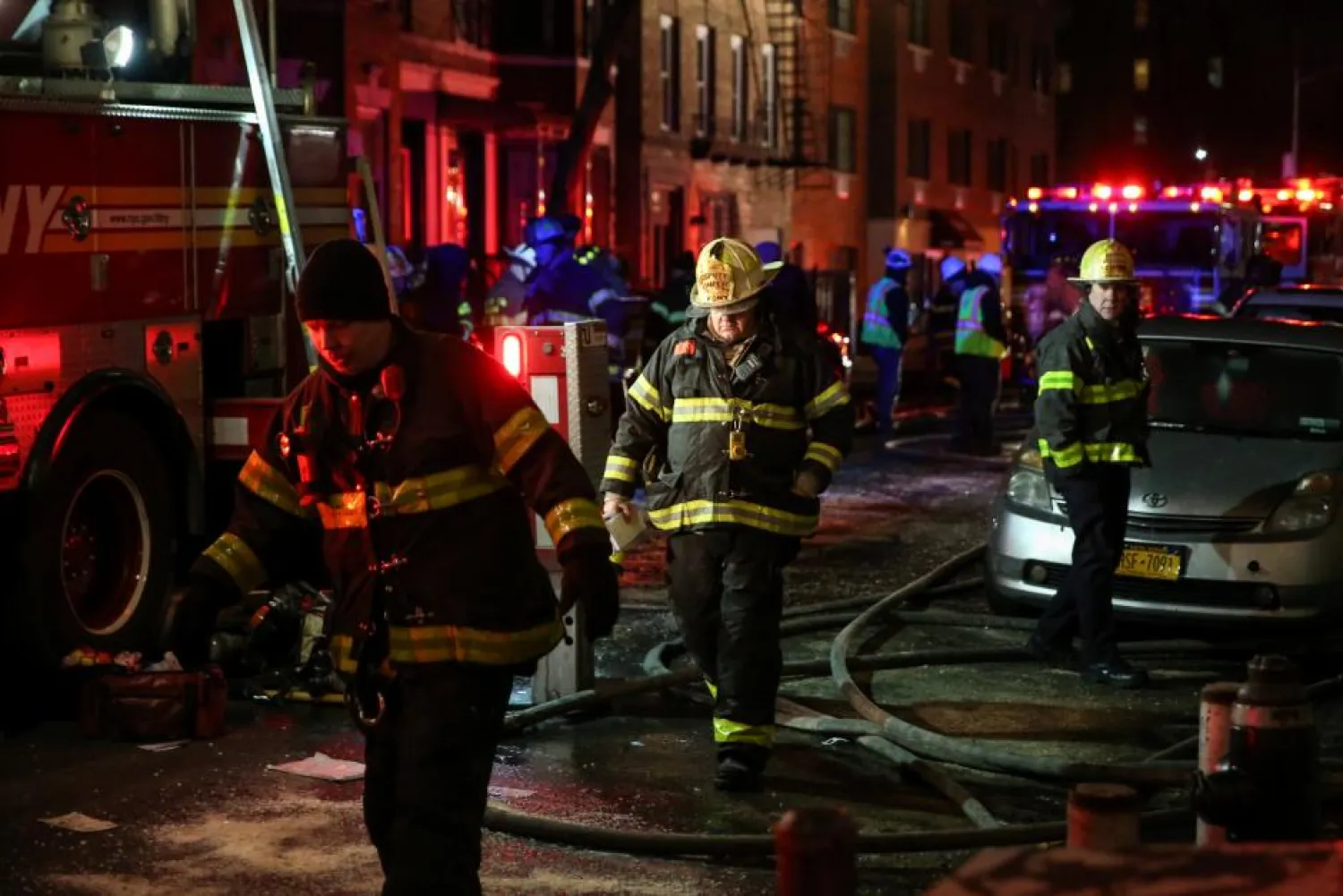 Fire Department of New York (FDNY) personnel work on the scene of an apartment fire in Bronx, New York, U.S., December 28, 2017. REUTERS/Amr Alfiky
