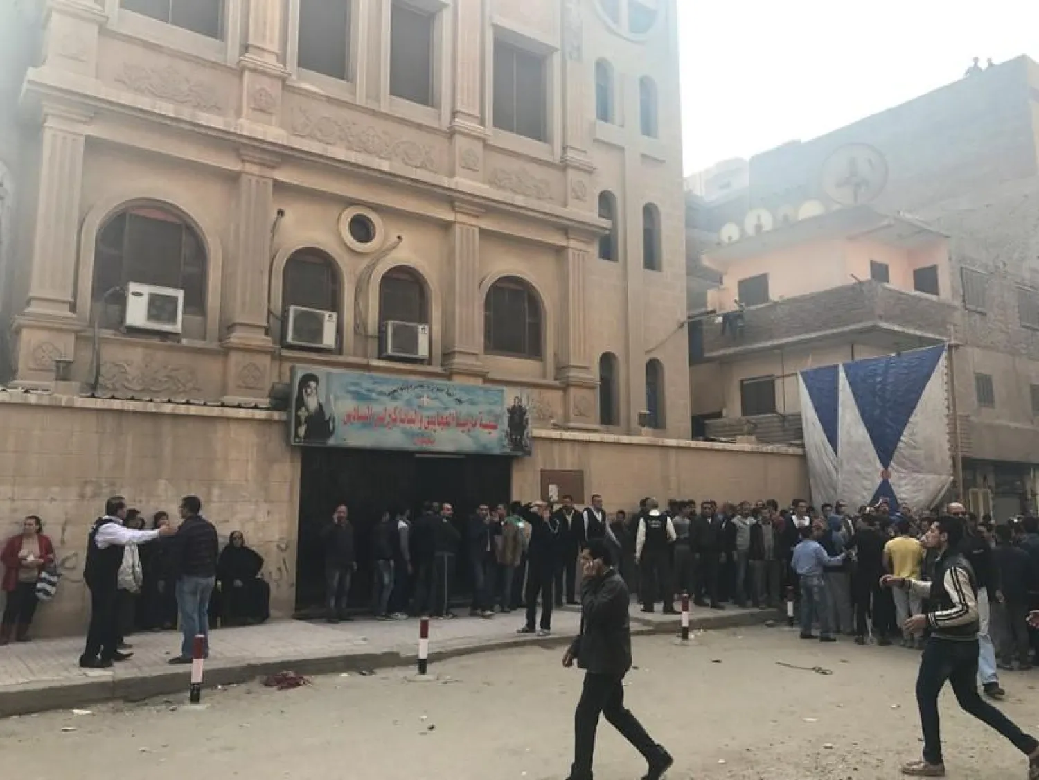 People are seen outside the Mar Mina Church after a blast, in Helwan district on the outskirts of Cairo, Egypt December 29, 2017. REUTERS/Amr Abdallah Dalsh