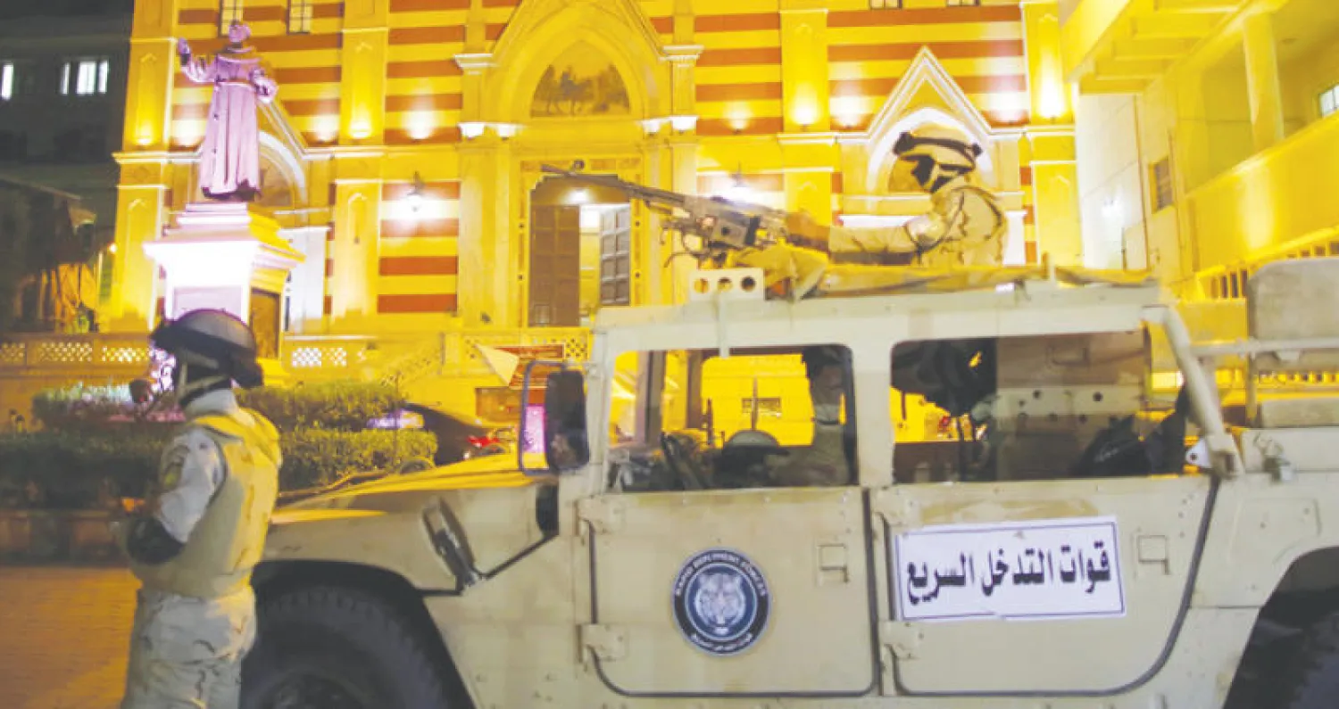 وجود أمني مكثف خارج كنيسة في القاهرة خلال الاحتفال بأعياد رأس السنة  (إ.ب.أ)